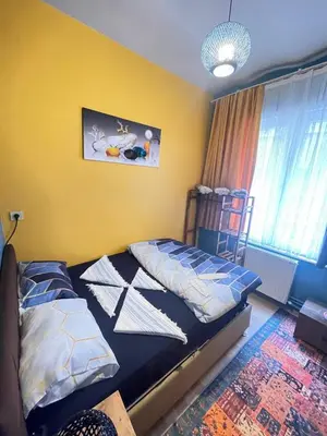 a bedroom with a bed with pillows on it at TAKSİM PERA House in Istanbul