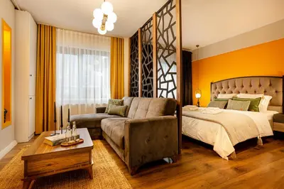 a living room with a bed and a couch at Port Galata Suites in Istanbul