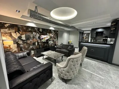 a living room with a couch and a table at Rose Plus Residence in Istanbul