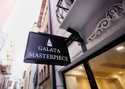 a sign on the side of a store at Galata Master Hotel in Istanbul