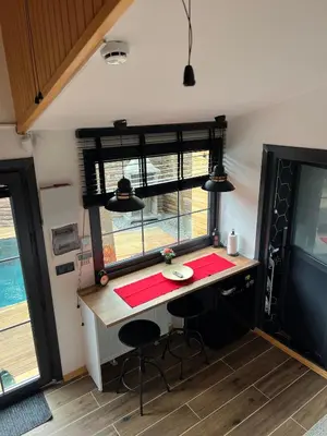 a desk in a tiny house with a window at Pentalow Cabin in Kocaeli
