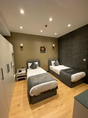 a bedroom with two beds in a room at Hmz LUXURY HOTEL in Çekmeköy