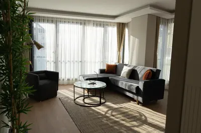 a living room with a couch and a table at Bolahenk Suites in Istanbul