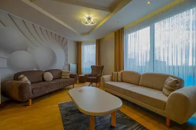 a living room with two couches and a table at Ar-mo-ni in Istanbul