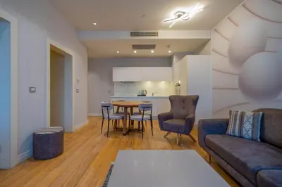 a living room with a couch and a table at Ar-mo-ni in Istanbul