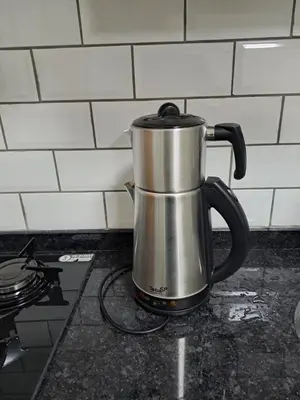 a tea kettle sitting on top of a stove at Taksim Nida Flats in Istanbul