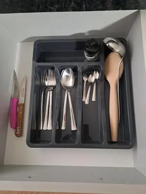 a black tray with utensils in a drawer at Taksim Nida Flats in Istanbul