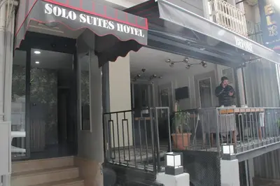 a man standing in front of a store front at Solo Suites Hotel in Istanbul