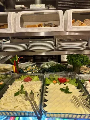 a refrigerator filled with different types of food at GROSS HOTEL in Istanbul