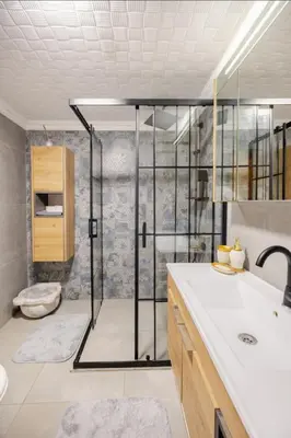 a bathroom with a shower with a sink and a toilet at Villa Base Kırkpınar Detached Villa with pool in Sapanca