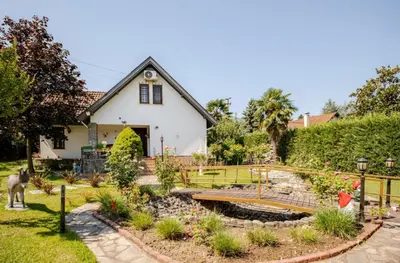 a house with a garden in front of it at Villa Base Kırkpınar Detached Villa with pool in Sapanca