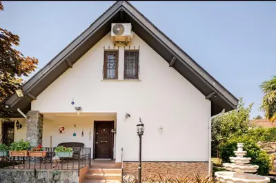 a white house with a black roof at Villa Base Kırkpınar Detached Villa with pool in Sapanca