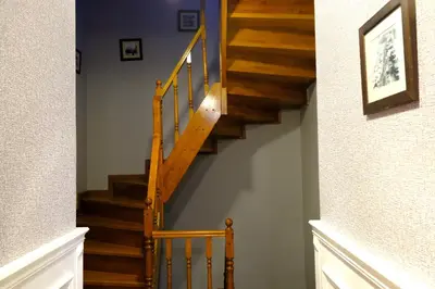 a staircase in a home with wooden steps at Olympos Garden Hotel in Istanbul