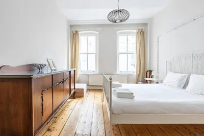 a bedroom with a large bed with a wooden floor at Bright Charming 2BD15Bath GalataTower Home! #257 in Istanbul