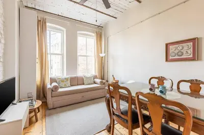 a living room with a table and a couch at Bright Charming 2BD15Bath GalataTower Home! #257 in Istanbul