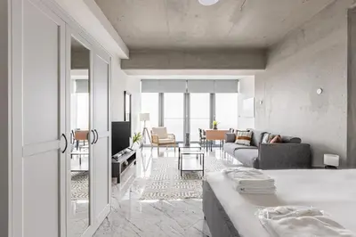 a living room with a bed and a couch at Trendy Cool Bright Studio Parking PoolViews! #254 in Istanbul