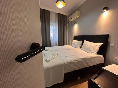 a bedroom with a bed with a black headboard at Asparagus HOTEL & SUITES OLD CITY in Istanbul
