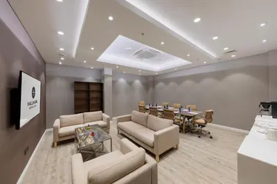 a meeting room with a table and chairs and a table at Hallmark Hotel & SPA Istanbul in Istanbul