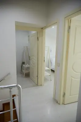 a room with a door and a mirror in it at Kaplan Luxury Family Flat - 3 Bedrooms with air conditioning & heating in the City in Istanbul