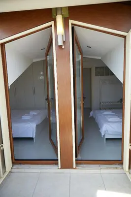 two windows in a room with two beds at Kaplan Luxury Family Flat - 3 Bedrooms with air conditioning & heating in the City in Istanbul