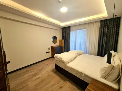 a bedroom with a bed and a large window at Halij suite in Istanbul
