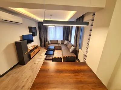a living room with a couch and a table at Halij suite in Istanbul