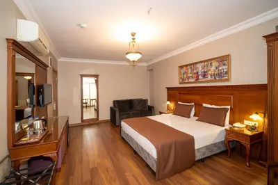 a hotel room with a bed and a chair at Hotel Blisstanbul in Istanbul