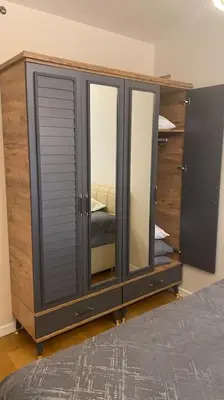 a bedroom with a dresser with a mirror at Cebeci Chic and Cosy Apartments in Istanbul