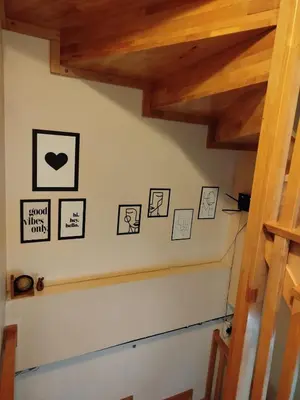 a staircase with some pictures on the wall at İstanbulda merkezi pitoresk konum müstakil yeni ev in Istanbul