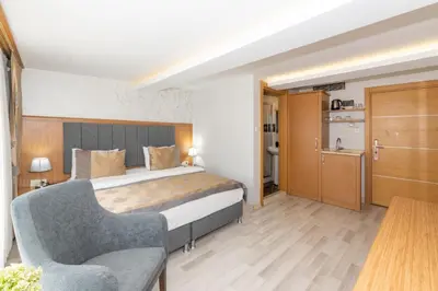 a hotel room with a bed and a chair at GalataportWawhotel in Istanbul