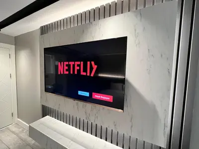 a tv on a wall with anetflix sign on it at BALA HOTEL in Tuzla