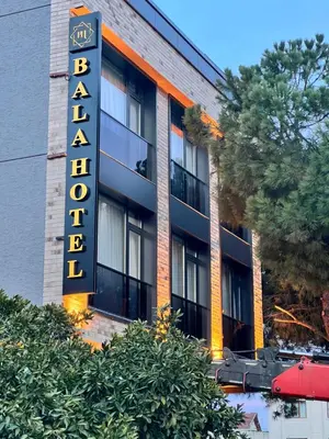 a building with a sign for a hotel at BALA HOTEL in Tuzla