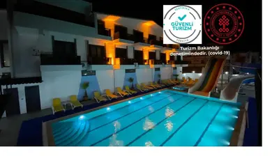 a pool on a cruise ship with a sign that reads virgin britainaris at ATAŞ AQUA OTEL AVŞA in Samanlı