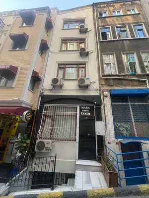 a building with a sign on the front of it at Mara Suite Taxim in Istanbul