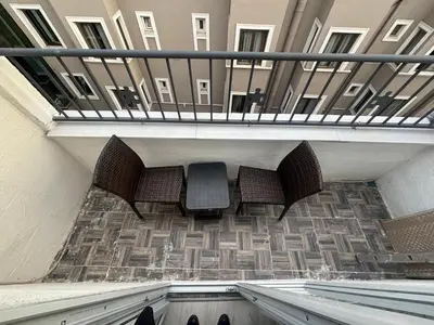 two chairs sitting on a staircase in a building at Mara Suite Taxim in Istanbul