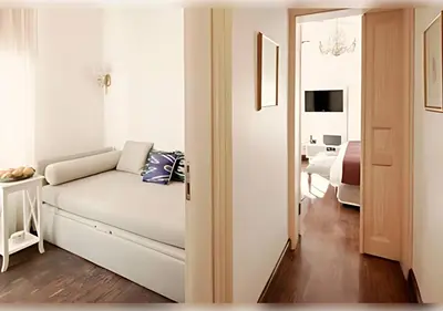 a living room with a couch and a bedroom at Baylo Suites in Istanbul