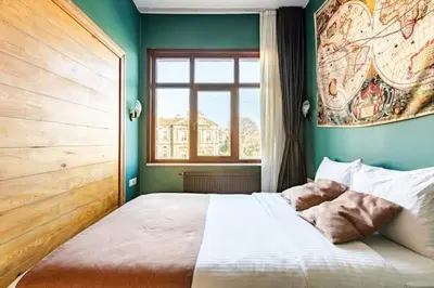 a bedroom with a large bed with a window at Waterfront Apartment by the Tram- Terrace with Dome & Golden Horn View in Fatih in Istanbul