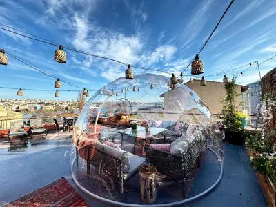 a glass dome sitting on top of a patio at Waterfront Apartment by the Tram- Terrace with Dome & Golden Horn View in Fatih in Istanbul