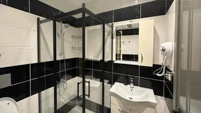 a bathroom with a glass shower and a sink at The Haliç Bosphorus Hotel in Istanbul
