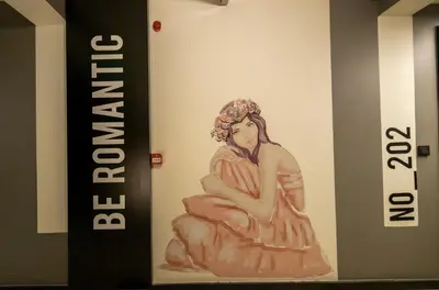 a painting of a woman on a wall at Ava Istanbul City Center Hotel in Istanbul