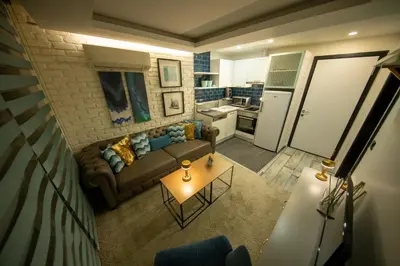 a living room with a couch and a table at Ava Istanbul City Center Hotel in Istanbul