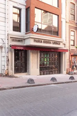 a pizzeria on the corner of a city street at Lilium Luxury Suites in Istanbul