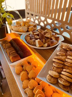 a table topped with plates of pastries and other foods at Ottoman Luxury Hotel in Istanbul