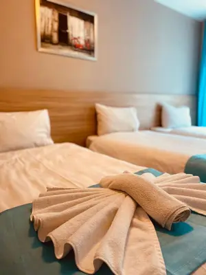 two beds with towels on top of them in a room at Ottoman Luxury Hotel in Istanbul