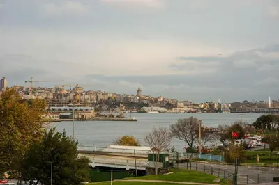 a view of a city with a large body of water at Waterfront Apartment by the Tram - Terrace with Dome & Golden Horn View in Fatih in Istanbul