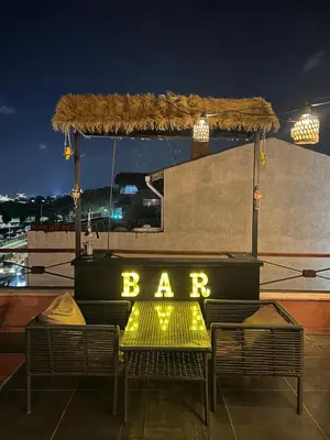 a bar sign sitting on top of a roof at Waterfront Apartment by the Tram - Terrace with Dome & Golden Horn View in Fatih in Istanbul