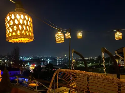 a group of lights on a balcony at night at Waterfront Apartment by the Tram - Terrace with Dome & Golden Horn View in Fatih in Istanbul