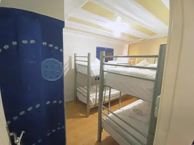 a small room with two bunk beds in it at Taksim History Wooden Hostel in Istanbul