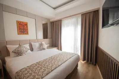 a hotel room with a large bed and a window at Vera Life Hotel in Istanbul