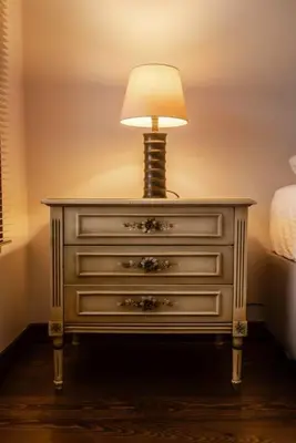 a white dresser with a lamp on top of it at Historical Greco-Ottoman Pavilion near Tram in Fatih in Istanbul